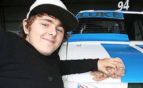 Sixteen-year-old Luke Watt polishes the car he races at the Lismore Speedway. Sixteen-year-old Luke Watt polishes the car he races at the Lismore Speedway.